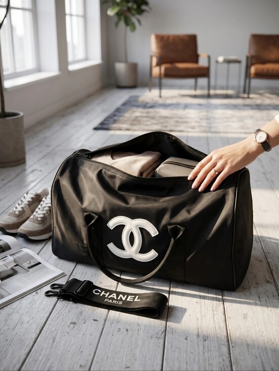 CHANEL Handbags - CHANEL Black Duffel with White Or Black CC Emblem